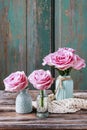 Beautiful pink roses, wooden background Royalty Free Stock Photo