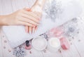 Beautiful pink and silver Christmas manicure with spa essentials Royalty Free Stock Photo