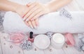 Beautiful pink and silver Christmas manicure with spa essentials Royalty Free Stock Photo