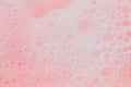 Beautiful pink soap bubbles background, orange and white foam bubble texture Royalty Free Stock Photo