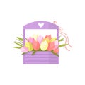 Beautiful pink spring flowers tulip bouquet in wooden box with handle decorated heart over white Royalty Free Stock Photo