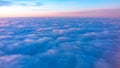 Beautiful pink sunrise over the clouds, view from the plane Royalty Free Stock Photo