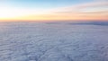 Beautiful pink sunrise over the clouds, view from the plane Royalty Free Stock Photo