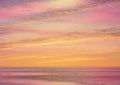 Beautiful pink sunset at sea  water reflection sun light on  gold yellow  clouds sky  nature background Royalty Free Stock Photo