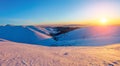 Beautiful pink sunset shine enlightens the picturesque landscapes with fair trees covered with snow and high mountains. Royalty Free Stock Photo