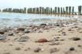 Beautiful pink sunset sky over sea coast with pebble beach. Photo is frozen using long shutter speed. Beautiful sea landscape