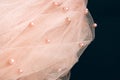 Beautiful pink tulle with shiny beads on a black background Royalty Free Stock Photo