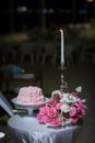 beautiful pink wedding cake. white vintage wedding cake on wooden table Royalty Free Stock Photo