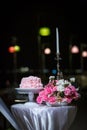 Beautiful pink wedding cake. white vintage wedding cake on wooden table Royalty Free Stock Photo