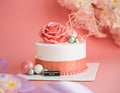 Beautiful pink and white cake with a big rose on top