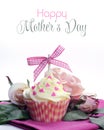 Beautiful pink and white cupcake with bow, hearts and flowers with Happy Mothers Day