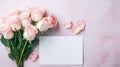 Beautiful pink and white rose flower bouquet and blank note paper on pink backdrop, Mothers day and Valentine s day background. Royalty Free Stock Photo