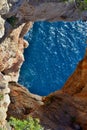 Beautiful Pirates Cave in Spain near Calpe, orange rock and blue sea. Royalty Free Stock Photo