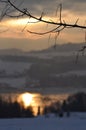 Winter scene with mountains, trees, sunset and snow Royalty Free Stock Photo