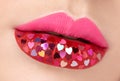 Beautiful plump pink lips with pasted hearts