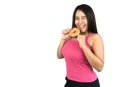 Beautiful plus size Asian woman holding a doughnut