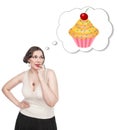 Beautiful plus size woman dreaming about cake Royalty Free Stock Photo