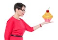 Beautiful plus size woman holding cake on her hand Royalty Free Stock Photo