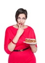 Beautiful plus size woman temptating with cake Royalty Free Stock Photo