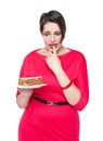 Beautiful plus size woman temptating with cake