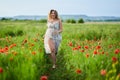 Beautiful plus size woman in a poppy field Royalty Free Stock Photo