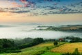 Beautiful Poland Countryside. Rolling Hills and Meadows Under Fog at Sunrise