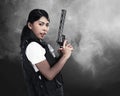 Beautiful police woman holding gun Royalty Free Stock Photo