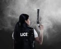 Beautiful police woman holding gun Royalty Free Stock Photo