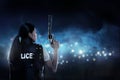 Beautiful police woman holding gun Royalty Free Stock Photo