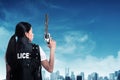 Beautiful police woman holding gun Royalty Free Stock Photo