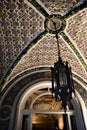 Beautiful polychromatic ceiling of a room and a glimpse of the ceiling of the adjacent corridor of the Stibbert museum. An antique