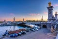 Beautiful Pont Alexandre III bridge over the Seine river at sunset, Paris. France Royalty Free Stock Photo