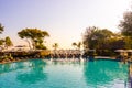 beautiful pool chair bed and umbrella around swimming pool in hotel resort Royalty Free Stock Photo