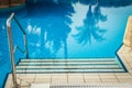 A beautiful pool with steps near the sea on nature background Royalty Free Stock Photo