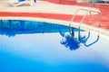 beautiful pool with steps near the sea on nature background Royalty Free Stock Photo