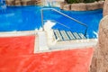 beautiful pool with steps near the sea on nature background Royalty Free Stock Photo