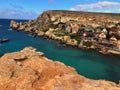 Beautiful popeye village on the island of malta, with colorful houses and a crystal blue sea that enchant Royalty Free Stock Photo