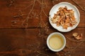 Beautiful porcelain white chinese cup of herbal tea and saucer w Royalty Free Stock Photo