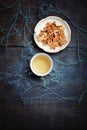 Beautiful porcelain white chinese cup of herbal tea and saucer w Royalty Free Stock Photo