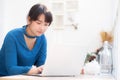 Beautiful portrait asian young woman working online on laptop sitting at cafe shop, professional female freelance using notebook Royalty Free Stock Photo