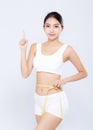 Beautiful portrait asian woman diet and slim with measuring waist for weight finger pointing something isolated Royalty Free Stock Photo