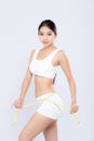 Beautiful portrait asian woman diet and slim with measuring waist for weight isolated on white background Royalty Free Stock Photo