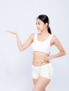 Beautiful portrait asian woman diet and slim with measuring waist for weight presenting something on hand isolated Royalty Free Stock Photo