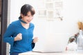 Beautiful portrait asian young freelance woman working online laptop with smile and happy sitting at cafe shop Royalty Free Stock Photo