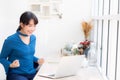 Beautiful portrait asian young freelance woman working online laptop with smile and happy sitting at cafe shop. Royalty Free Stock Photo