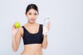 Beautiful portrait asian young woman bottle of water and green apple for healthy isolated on white background Royalty Free Stock Photo