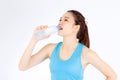 Beautiful portrait asian young woman in sport clothing drink bottle of water for healthy isolated on white background, girl with Royalty Free Stock Photo