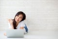 Beautiful portrait asian young woman working online laptop with Royalty Free Stock Photo