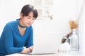 Beautiful portrait asian young woman working online on laptop sitting at cafe shop Royalty Free Stock Photo