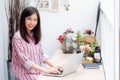 Beautiful of portrait asian young woman working online on laptop sitting at coffee shop. Royalty Free Stock Photo